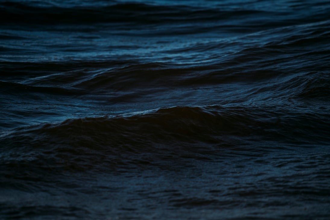 Surface of open dark blue sea water